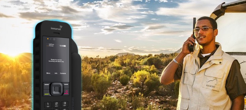 Inmarsat IsatPhone 2 beside a man making a call on one in the bush